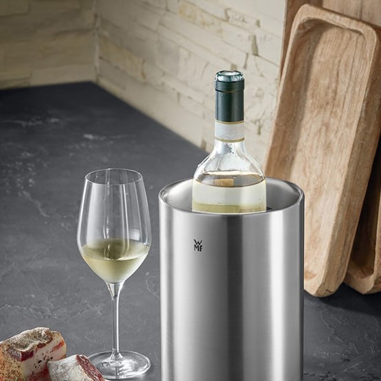 Wine Accessories  A fine collection of WMF wine accessories, including a wine cooler and a wine bottle stopper.
